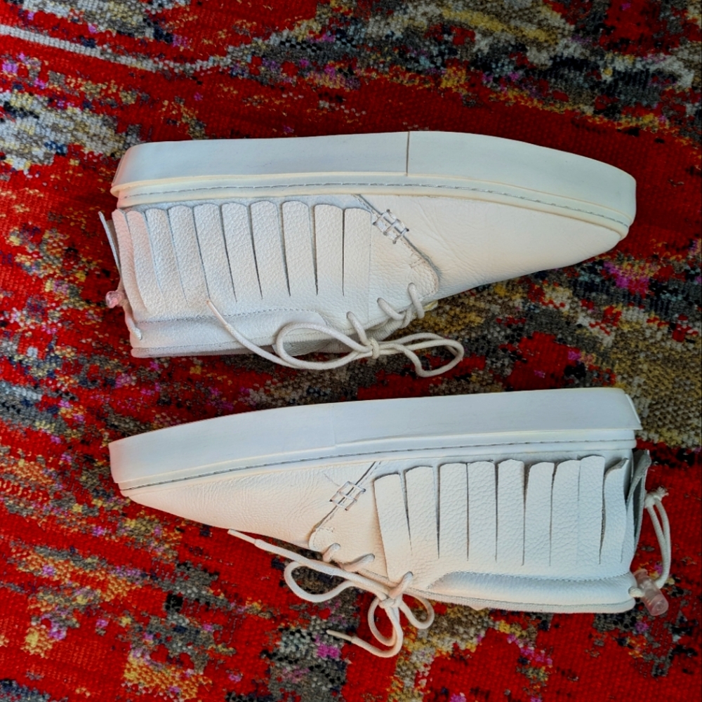 All white Clear Weather Brand moccasin sneakers